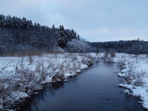 stream with banks covered in snow