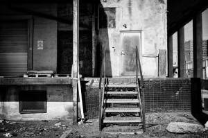 rotted door outside a crumbling building