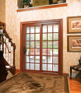 A beautiful wood sliding glass door on the entryway of a home.