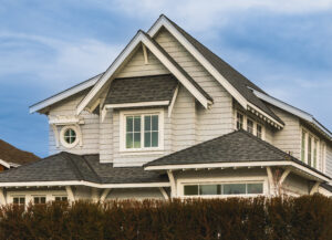 Home with tan siding and white-framed windows