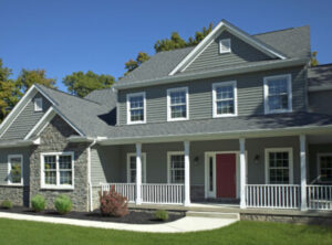 large, two-story home with gray siding and sleek windows