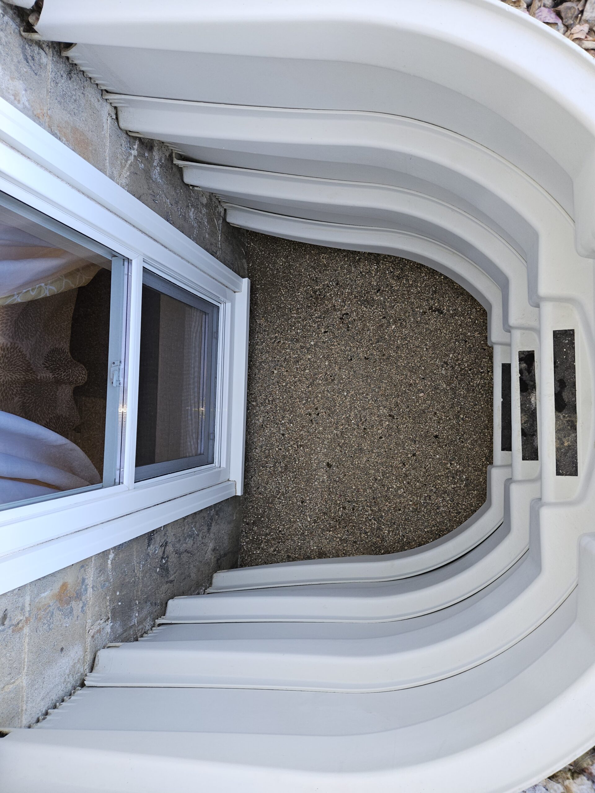 Murnan-exterior-Escape-window & well